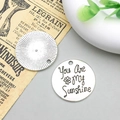 Close-up of You Are My Sunshine engraved silver alloy pendants for DIY jewelry - You Are My Sunshine (8995)
