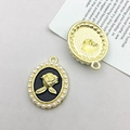 Vintage oval pendant featuring a gold relief rose on black enamel with pearl border - KC Gold Black Base Rose (15897)