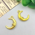 Pair of vintage gold alloy crescent moon charms with embossed face for DIY jewelry making - Antique Gold Moon