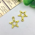 Set of two hollow star charms in antique gold finish for DIY jewelry making - Antique Gold Star