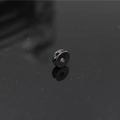 Macro detail of a black plated round spacer bead with pavé-set black crystals for jewelry DIY - Gun Black Black Zircon