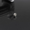 Macro shot of a silver spacer bead with black rhinestones for DIY jewelry making - Silver/Black Zirconia