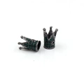 Macro detail of gunmetal crown beads with green rhinestones for DIY jewelry making - Gunmetal Black With Green Zirconia