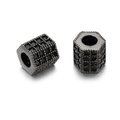 Macro detail of hexagonal gun black spacer beads with micro-pave black zircon settings - Gun Black Hexagonal Column Black Zirconia (ZJ2389H)