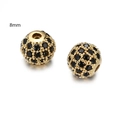 Gouden 8mm bolkralen met zwarte micro-ingelegde zirkoon op witte achtergrond - Goud Zwarte Zirkonia