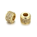 Macro shot of gold-plated cylinder charms with pavé cubic zirconia and milgrain edges - Gold White Zirconia