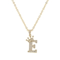 Detailed view of gold necklace with letter E pendant featuring a zircon-studded crown - Letter E / Gold