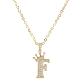 Close-up of gold crown letter F pendant necklace with pavé zircon stones on white backdrop - Letter F / Gold