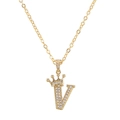 Close-up of golden crown letter V pendant with sparkling zircon inlays on an O-chain - Letter V / Gold