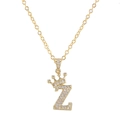 Detailed close-up of gold-plated letter Z pendant with zircon crown and dainty chain - Letter Z / Gold