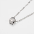 Macro view of a minimalist silver cube pendant on a durable stainless steel O-chain - Cube Style (ZJ4070)
