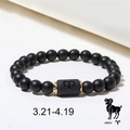 Macro detail of Aries zodiac bead bracelet with black onyx stones and golden spacers - Aries (ZJ4596)