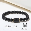 Detailed macro view of Scorpio matte black onyx beaded bracelet with gold spacers - Scorpio (ZJ4603)