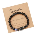 Detail of Scorpio zodiac bracelet with matte black beads and marble accent on craft card - Scorpio (ZJ9626)