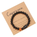 Close-up of Capricorn matte black agate beaded bracelet on a kraft display card - Capricorn (ZJ9628)