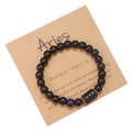 Close-up of Aries zodiac bracelet with black matte beads and blue stone on display card - Aries (ZJ9619)