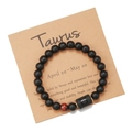 Detail of Taurus zodiac bracelet with matte black beads and red tiger eye stone on kraft card - Taurus (ZJ9620)
