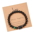 Macro detail of Leo zodiac bracelet with matte black beads and green tiger eye stone - Leo (ZJ9623)