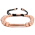 Macro shot of rose gold bead bracelet with zircon bar and black braided cord - Rose Gold (ZJ6656)