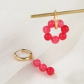 Macro detail of asymmetric gold hoop earrings featuring pink crystal beads and pearls - Pink Bead (ZJ6524)