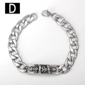 Macro view of stainless steel Cuban chain bracelet featuring skull and dagger engraving - 18cm / Skull Dagger Style (D)