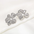 Elegant silver stainless steel flower earrings with white pearl center on silk background - Silver