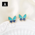 Elegantes pendientes de mariposa dorados con esmalte azul en base de cerámica - Degradado Azul Y Cian (A)