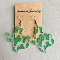 Detail of Texas map acrylic earrings featuring green cactus print and silver ear hooks - Cactus Pattern Texas Map (1)