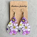 Macro detail of acrylic teardrop earrings with purple cosmos floral pattern on a card - Purple and White Cosmos Print