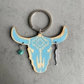 Detail view of wooden bull head keychain with turquoise stone and silver feather charm - Ethnic Geometric Totem (3)