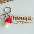 Macro detail of wooden Mother's Day keychain with mama best ever text and pink tassel - Peach Pink Gradient Tassel (7)