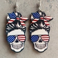 Detail view of Independence Day wood earrings with patriotic skull and flag patterns - Wood US Flag Messy Bun Skull