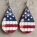 Detail of teardrop wooden earrings featuring a distressed American flag star and stripe pattern - Flag Teardrop Style