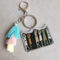 Detail of Be Kind acrylic keychain with rainbow tassel and silver metal lobster clasp - Transparent Blue Pink Yellow Contrast Tassel (5)