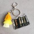 Macro view of Be Kind acrylic pendant with yellow gradient tassel and silver clasp - Black Background Colorful Print Yellow Gradient Tassel (8)