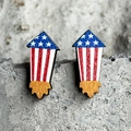Detail of wooden rocket earrings with American flag patterns and gold glitter accents - Rocket Style