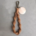 Macro view of handmade boho keychain with brown spiral knots and wooden tag detail - Spiral Woven Style (With Wood Tag) / Caramel color