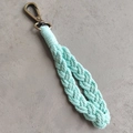 Detail of mint green hand-woven cotton keychain with antique brass carabiner hook - Basic Style / Mint Green