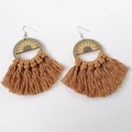 Detailed view of bohemian wood sunflower earrings with brown woven cotton tassels - Tan