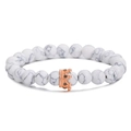 Close-up of 8mm white turquoise beads and rose gold crown charm on stretch bracelet - White Beads With Rose Gold Crown