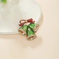 Macro detail of Christmas bell brooch with green enamel, red bow, and crystal accents - Three-Color Bells Style (ZJ8416)