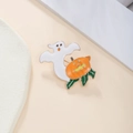 Macro shot of Halloween ghost and pumpkin enamel brooch with golden alloy edges - Halloween BOO Style (ZJ8419)