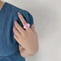 Pink resin clay ring featuring a yin yang pattern on a model finger with denim jacket - Pink Tai Chi Style(ZJ8106)