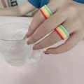 Multi-color rainbow polymer clay stackable rings shown on hand - Five Color Rainbow Ring Style(ZJ8103)