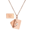 Macro detail of rose gold envelope locket with a pull-out metal card engraved Love You - Rose Gold Style (ZJ8990)