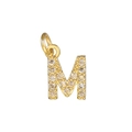 Macro shot of 18k gold plated letter M pendant with cubic zirconia for DIY jewelry - Letter M / Gold
