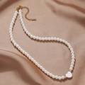 French vintage pearl choker necklace with a white heart shell pendant on silk background - Heart Pendant Style (ZJ10436)