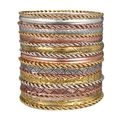 Detail of 19-piece bohemian bangle set featuring gold silver and rose gold metal textures - Multicolor