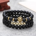 Men's matte black lava stone bead bracelet set with a gold lion head and elastic cord - Golden Lion Head Lava Style (ZJ10942)