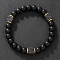Matte black obsidian beaded bracelet with square lava stones on black leather background - Gold Spacers Matte Black Lava Stone Bracelet (ZJ12327)